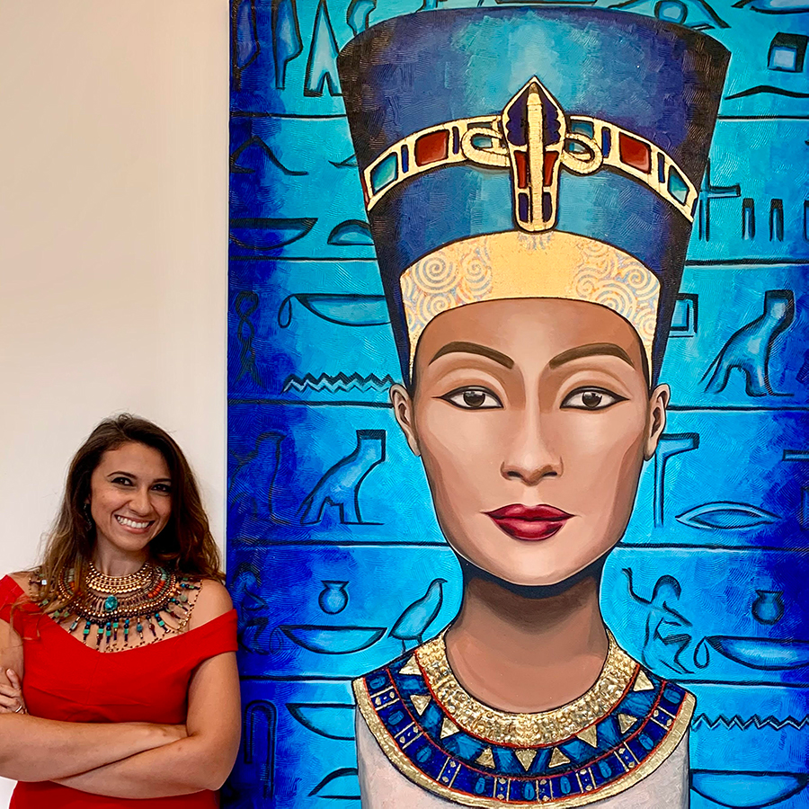 Salma Taman next to her painting of Queen Nefertiti