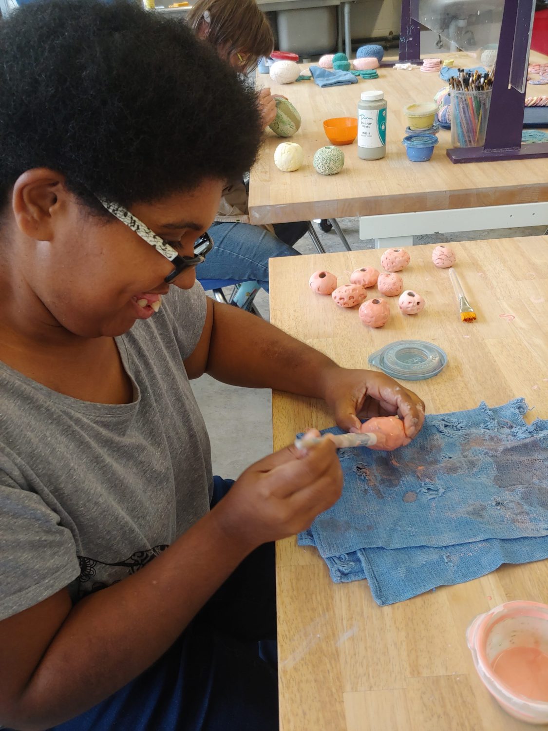 ArtMix participant creates a sculpture from clay
